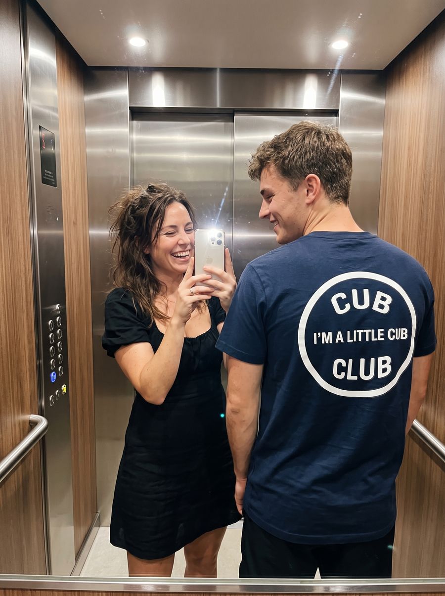 Elevator mirror selfie showing the Cub Club back print